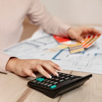 close-up-hand-using-calculator_23-2148819844